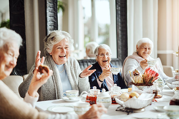 Shot of happy senior women having tea together at a retirement home
